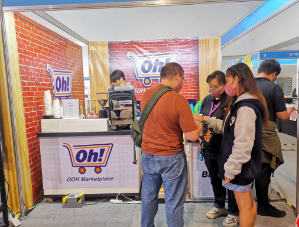Booth display at Graphic Expo 2023 with OOH Marketplace branding