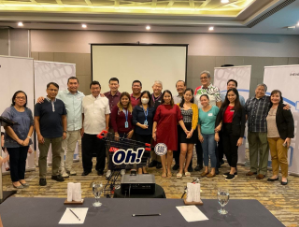 Group photo of Project Infinity symposium participants with Oh! branding